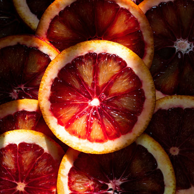 Overlapping slices of blood orange showing deep red flesh